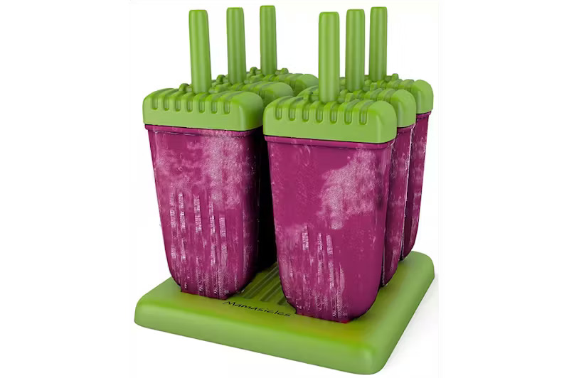 Four strawberry coconut popsicles on a green stand, a healthy frozen treat recipe for weight loss