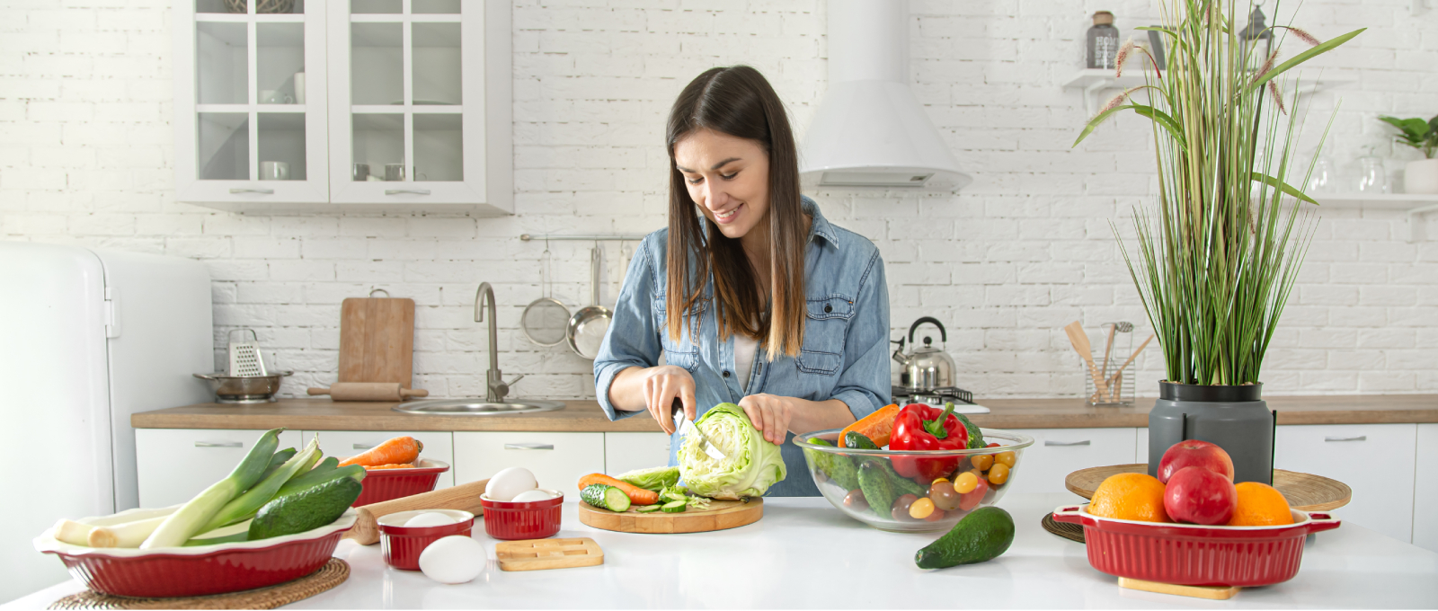 Woman preparing healthy cultural meal with fresh vegetables and traditional spices in home kitchen